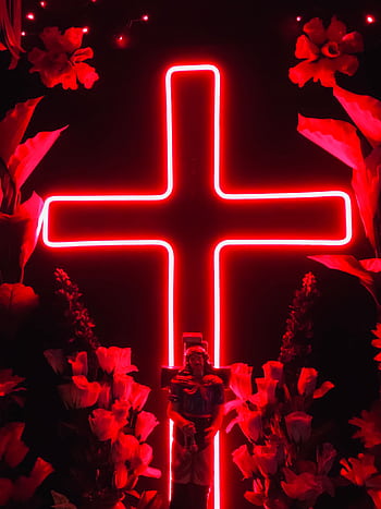 Vibrant red neon cross surrounded by glowing flowers, symbolizing faith and modern art. HD phone wallpaper