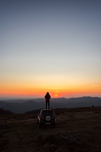 Nature, Sunset, Mountains, Miscellanea, Miscellaneous, Car, Machine, Human, Person HD phone wallpaper
