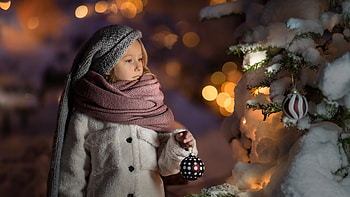 Cute Little Girl Is Wearing Woolen Knitted Cap Fur Cloth Dress Standing Near Frozen Decorated Christmas Tree In Blur Bokeh Background Cute HD wallpaper