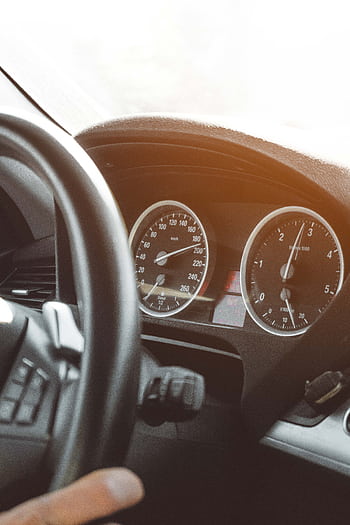 Close-up of a car's speedometer and dashboard illustrating modern vehicle design. HD phone wallpaper