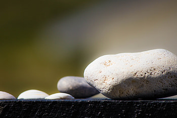 Focus on Stone, focus, green, blurry, stone, sun HD wallpaper