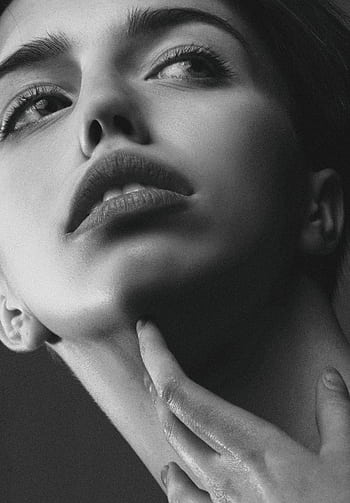 Stunning close-up of a young woman expressing elegance and beauty. HD phone wallpaper