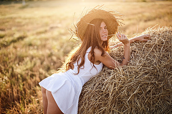 Chewing The Straw . ., cowgirl, brunettes, dress, outdoors, ranch, field, bale, hay, women, models, western, hats, female HD wallpaper