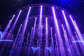 A captivating display of purple lights creating a mesmerizing pattern in a modern indoor setting. HD wallpaper