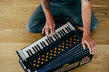 Yoga workshops and retreats, Harmonium practices, Musical immersion, Spiritual harmony HD wallpaper