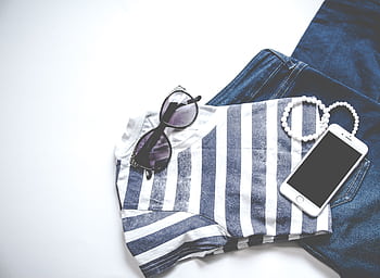 Flat lay featuring sunglasses, striped top, jeans, and smart, ideal for fashion and lifestyle themes. HD wallpaper