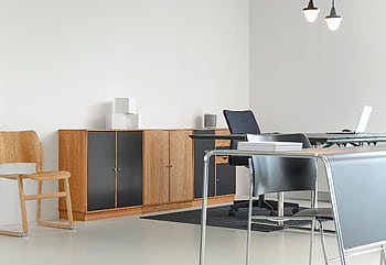 A clean and organized modern office space with stylish furniture and decor. HD wallpaper