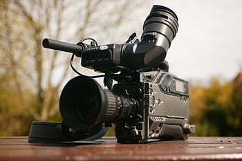High-quality broadcast camera set outdoors, ideal for media and videography projects. HD wallpaper
