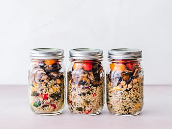 Colorful quinoa salad jar with roasted veggies, ideal for healthy meal prep. HD wallpaper