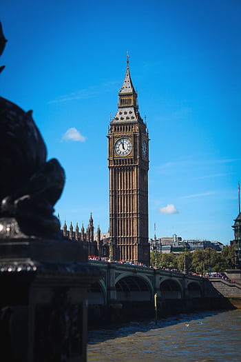Big Ben in London on a sunny day with a clear blue sky, perfect for travel enthusiasts. HD phone wallpaper
