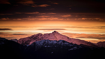 Dawn over the mountains, Cloud-laden skies, Nature's awakening, Breathtaking views HD wallpaper