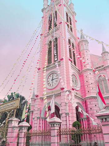 Low angle view of the vibrant pink Tan Dinh Church in Ho Chi Minh City, famous for its stunning architecture. HD phone wallpaper