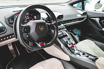 Explore the elegant and high-tech interior of a luxurious Lamborghini sports car. HD wallpaper