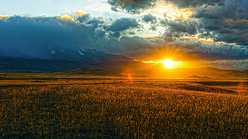 Glorious Sunset, sun, field, clouds, colors, landscape, sky, mountains HD wallpaper