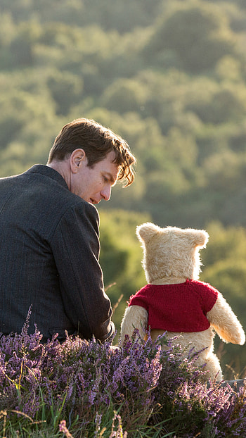 Winnie the Pooh in Christopher Robin movie, Endearing friendship, Charming animated character, Heartwarming tale HD phone wallpaper