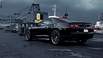 Black Chevrolet Camaro on a rainy day HD wallpaper