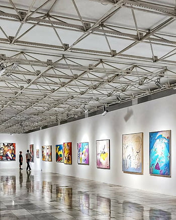 Explore a contemporary art exhibition in an elegant Brazilian gallery with vivid paintings. HD phone wallpaper