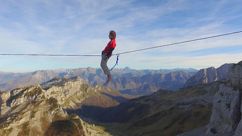 Aerial view of balancing on a slackline, Mountain tightrope, Fearless balance, Elevated thrill HD wallpaper