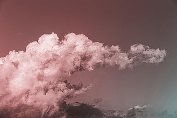 Stunning cloud formation set against a vibrant, colorful sky at twilight. HD wallpaper