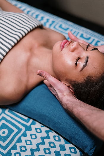 Indulge in a calming facial massage in a luxury spa setting, promoting relaxation and wellness. HD phone wallpaper