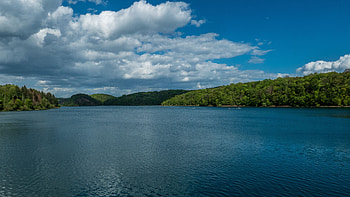 Landscape View Of Trees Forest Hills Lake Under White Clouds Blue Sky Nature HD wallpaper