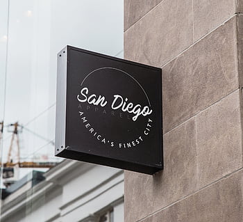 Storefront signage for a San Diego apparel shop displaying city pride. HD wallpaper