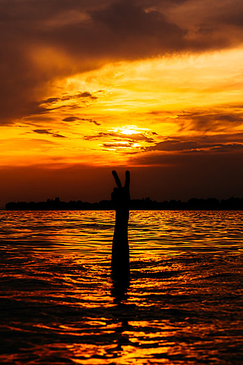 Water, Sunset, Glare, Hand, Miscellanea, Miscellaneous, Gesture HD phone wallpaper