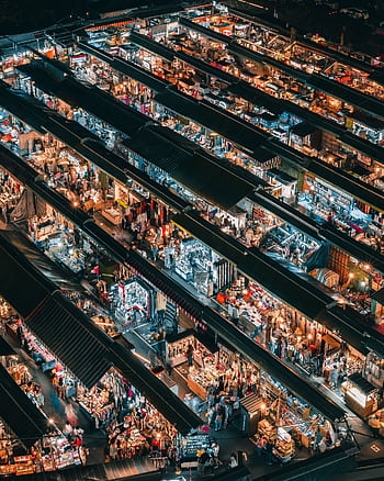 A bustling aerial view of a vibrant night market in Taiwan, showcasing diverse shopping stalls. HD phone wallpaper
