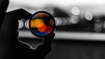 Colorful Bokeh Lens In Hand Dark Background Dark Background HD wallpaper