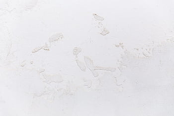 Close-up of a textured white stucco wall, ideal for design and decor projects. HD wallpaper