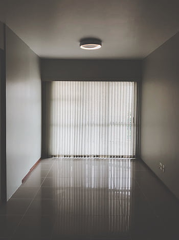 Spacious empty room with modern design featuring large window blinds and tiled floor. HD phone wallpaper