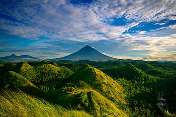 Beautiful landscape of Mayon Volcano amidst verdant hills in Bicol, Philippines. HD wallpaper