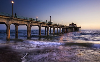 Ocean Pier, blue, sand, concrete, pier, beach, rock, daylight, day, waves, clouds, nature, sky, water, sunset, ocean HD wallpaper