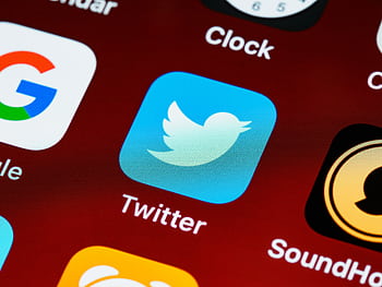 Detailed close-up of popular social media icons on a smart screen. HD wallpaper