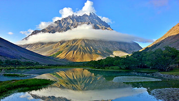 Landscape View Of Rock Mountain Peak With Fog In White Clouds Blue Sky Background Reflection On Lake Nature HD wallpaper
