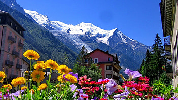 Houses Near The Mountain, peaks, slope, spring, houses, mountain, rest, snow, nature, flowers, sky HD wallpaper