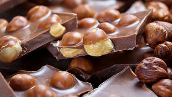 Milk chocolate, Irresistible hazelnuts, Decadent treat, Tempting HD wallpaper