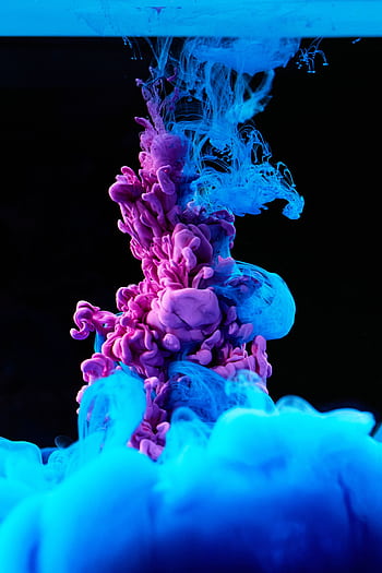 Vibrant blue and purple ink swirling in water creates a colorful abstract pattern. HD phone wallpaper