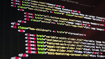 Close-up of HTML code highlighted in vibrant colors on a computer monitor. HD wallpaper
