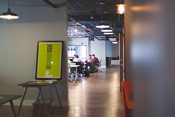 Contemporary open office space with people collaborating and working together. HD wallpaper