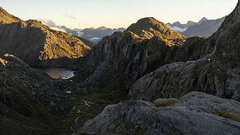 Valley of the Trolls, Mt Aspiring National Park, New Zealand, trees, hills, rocks, pond, sky HD wallpaper