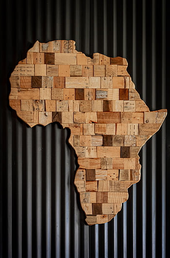 Artistic wooden map of Africa against dark corrugated background. HD phone wallpaper