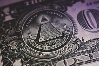 Detailed close-up of US dollar bill showing the Eye of Providence and pyramid design. HD wallpaper
