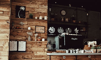 Warm rustic coffee shop interior featuring a wooden decor and a professional espresso machine. HD wallpaper