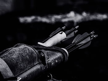 Dramatic black and white of arrows in quiver highlighting archery equipment. HD wallpaper