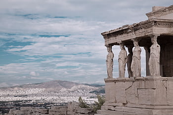 Erechtheion temple on the Acropolis, Athens, with iconic Caryatids statues. HD wallpaper