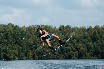 Man wakeboarding, Powerful wakeboarder, Dynamic action shot, Water sports enthusiast HD wallpaper