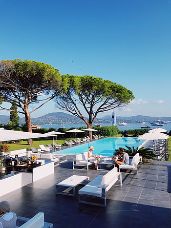 Relax by the infinity pool at a Saint-Tropez resort with stunning Mediterranean views. HD phone wallpaper