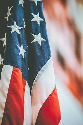 Detailed close-up of the American flag showing stars and stripes, symbolizing patriotism and dom. HD phone wallpaper