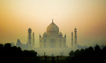 Misty view of the iconic Taj Mahal at sunrise, Agra, India. HD wallpaper